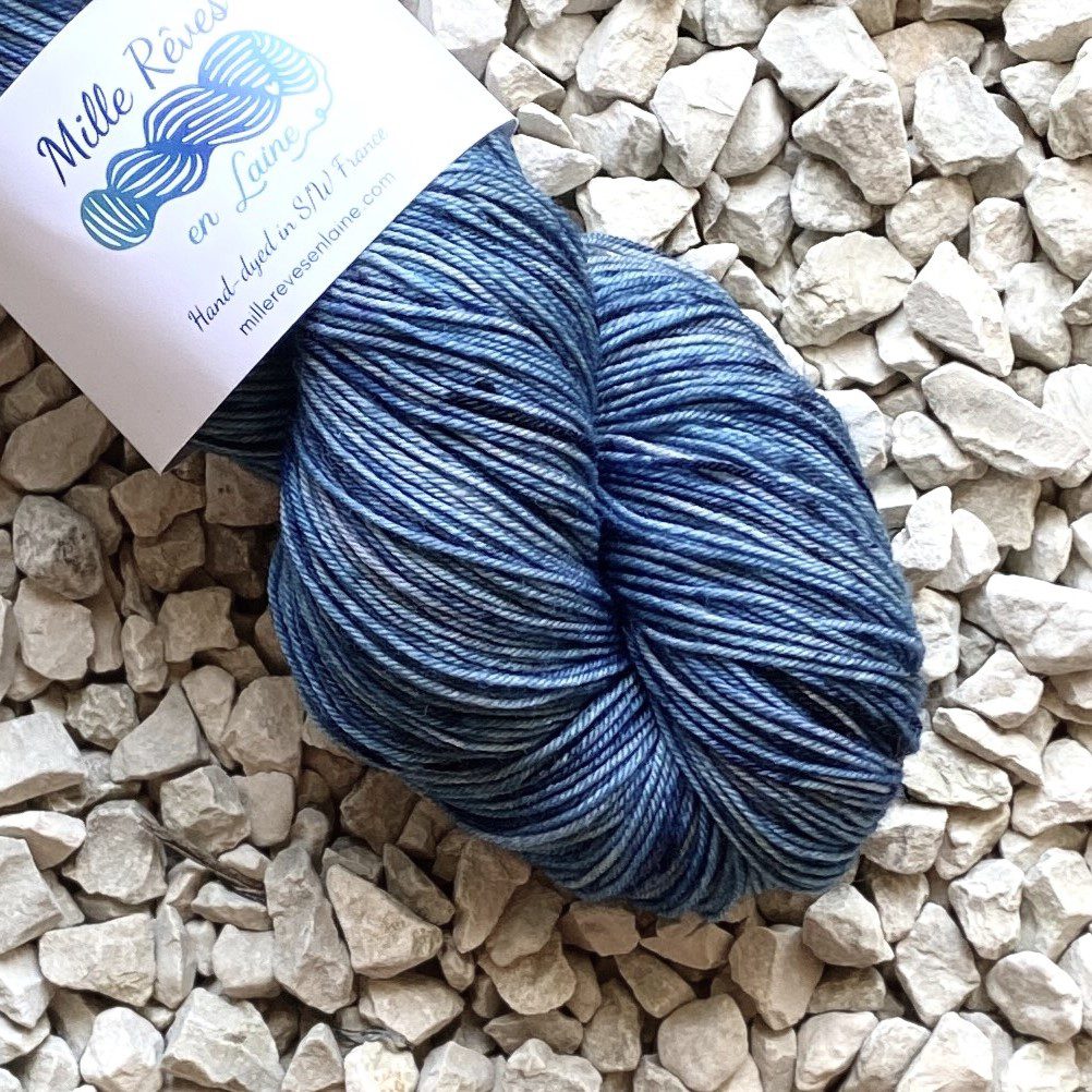 Close -up of the end of a skein of BFL wool/Nylon yarn hand dyed in colour 'Stormy Sky'