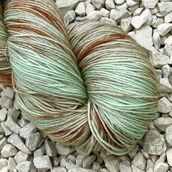 Misty Woodland BFL 4 Ply hand dyed in pale greens and chextnut browns