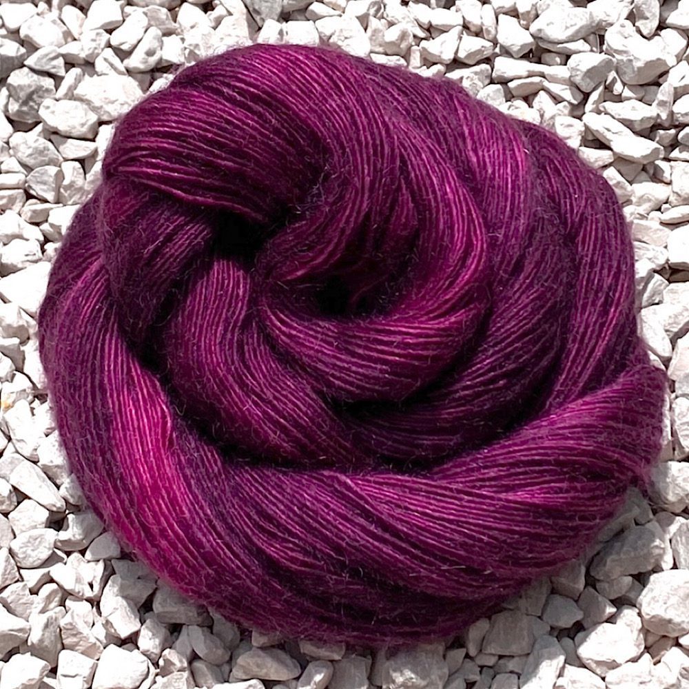 Merino/Mohair hand dyed yarn in colour: Bordeaux, Swirled to show off the range of rich wine-reds