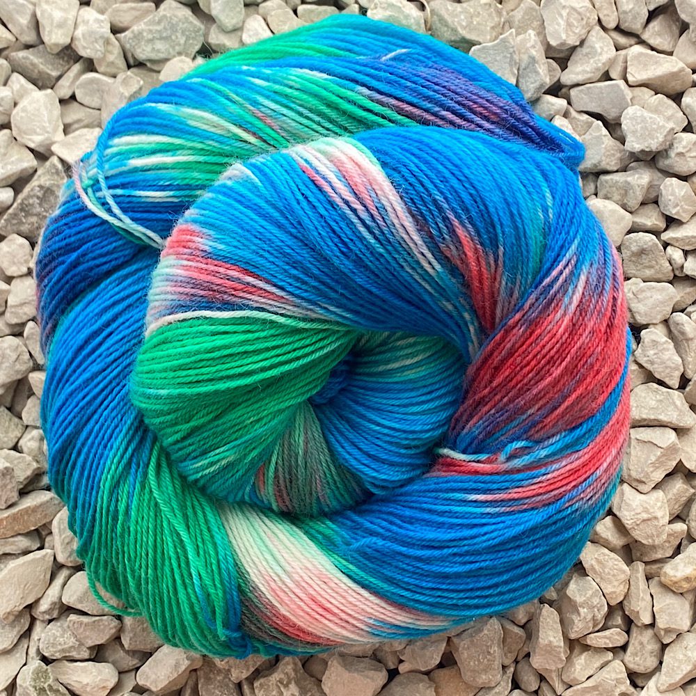 BFL/Nylon yarn in 'Hedgerow' reds, blues, greens