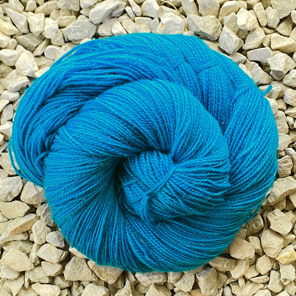 Swirl of merino sparkle 4 ply in ‘Marina’ a deep sea blue/green